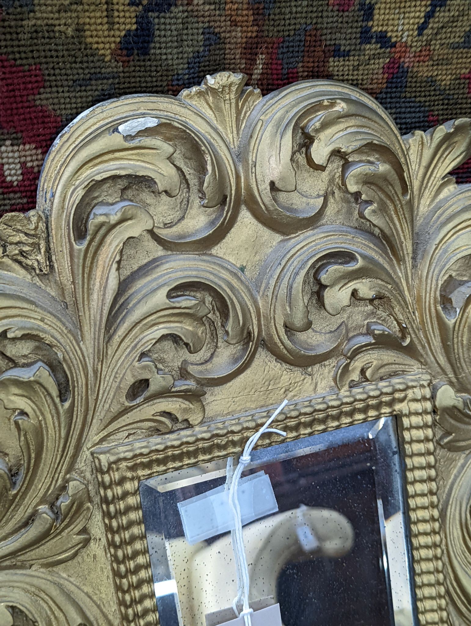 A small Florentine style gilt plaster acanthus scroll wall mirror, width 38cm, height 53cm